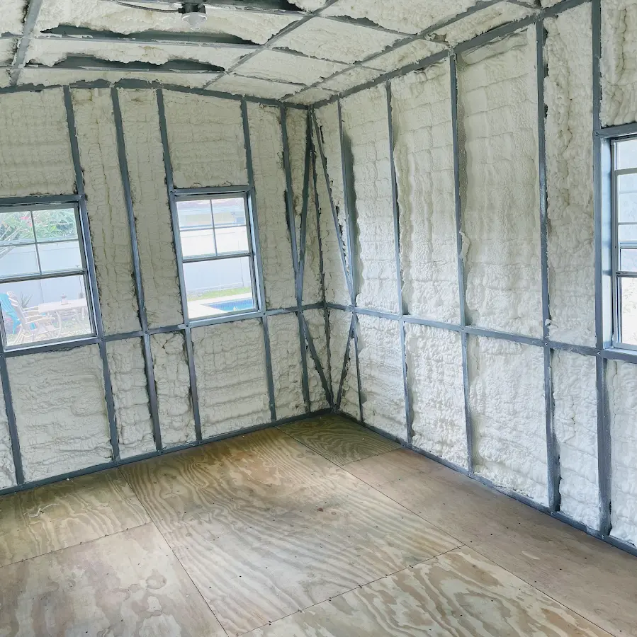 Closed-cell spray foam insulation applied to wall cavities in a residential project in Rockton